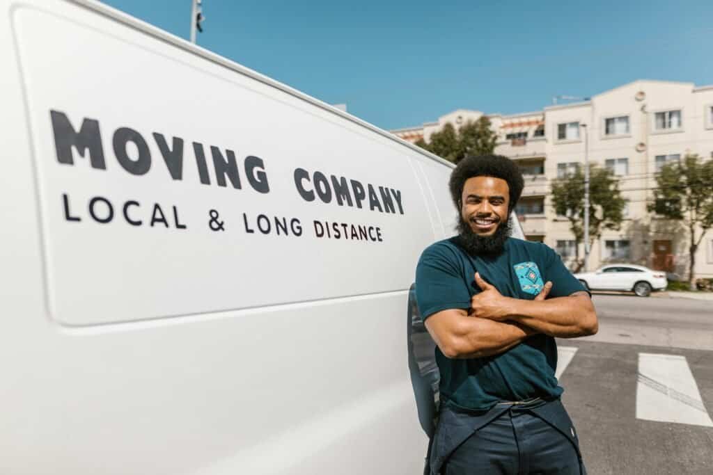 Mover employee by moving company startup truck