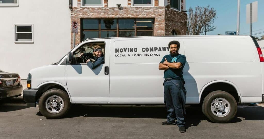 mover employees standing in front of truck