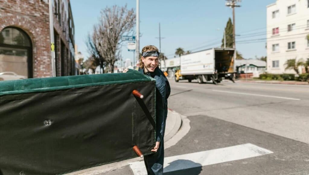 transporting items into the back of a moving truck